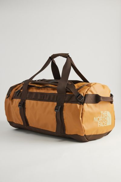 Shop The North Face Base Camp Duffle-m Convertible Duffle Bag In Amber Tan, Men's At Urban Outfitters