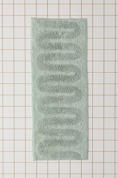 Tapis de bain touffeté à motif de boucles ondulées