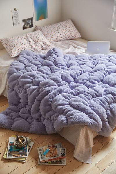 Shop Urban Outfitters Gwendolyn Fleece Puffy Throw Blanket In Blue Heron At