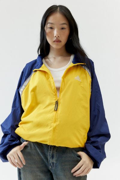 Shop Urban Renewal Vintage Branded Oversized Windbreaker Jacket In Warm, Women's At Urban Outfitters