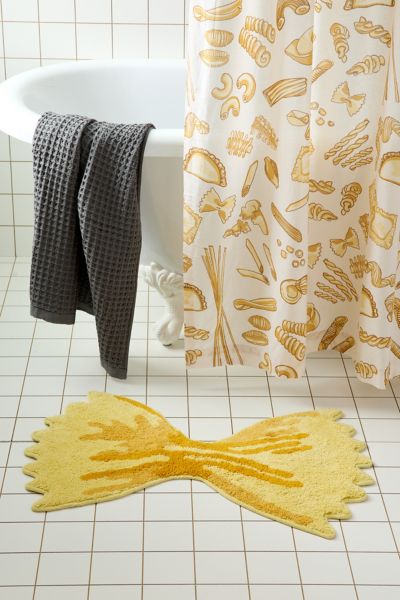 URBAN OUTFITTERS BOWTIE PASTA SHAPE TUFTED BATH MAT IN BOWTIE AT URBAN OUTFITTERS 