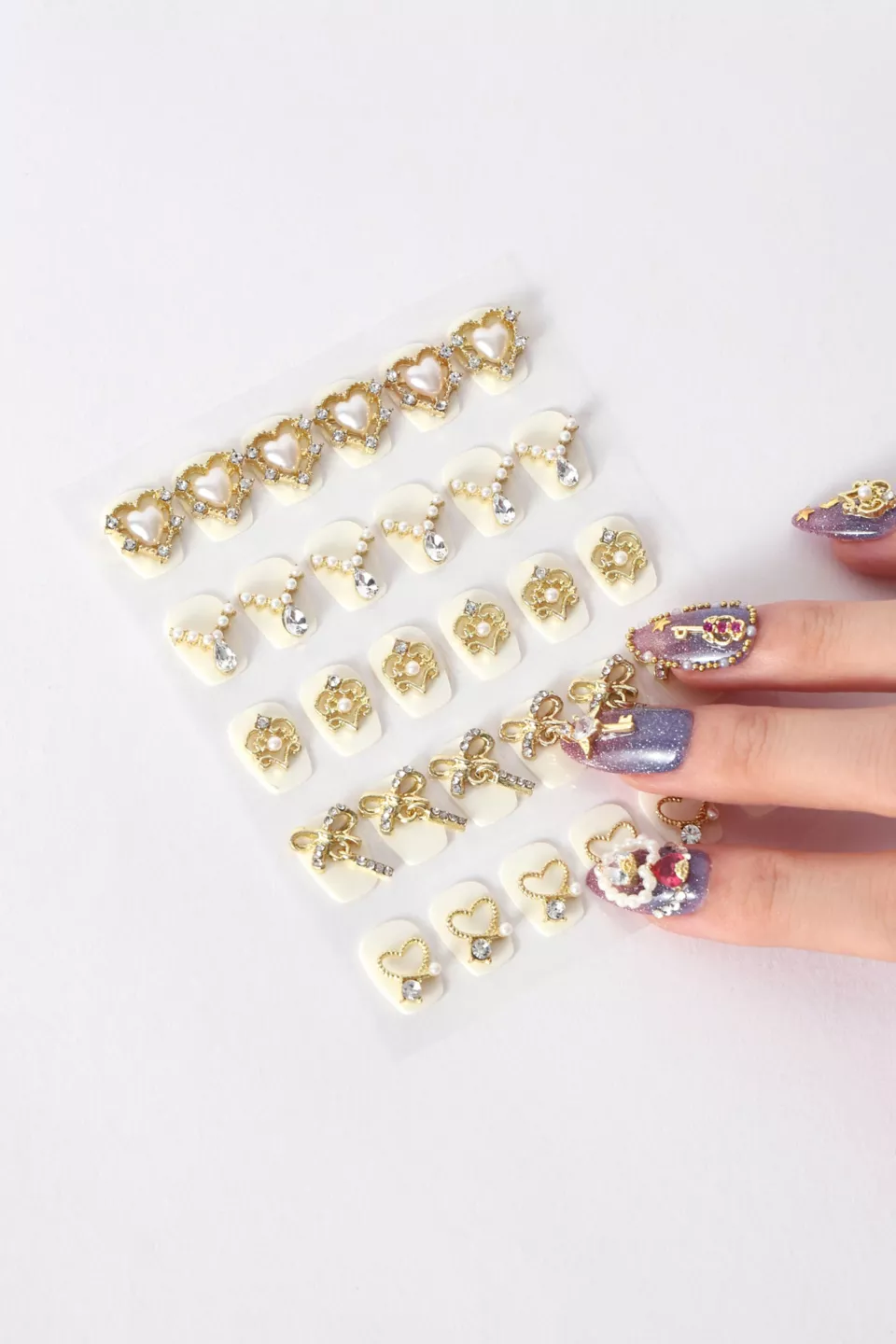 A sheet of gold and silver nail charms