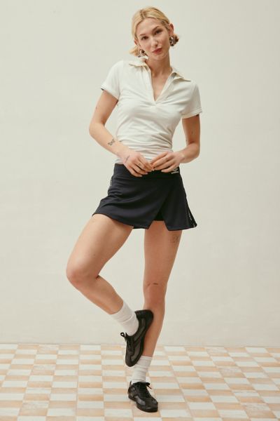 Umbro Uo Exclusive Wrap Mini Sport Skort In Black Beauty, Women's At Urban Outfitters In Black Beauty