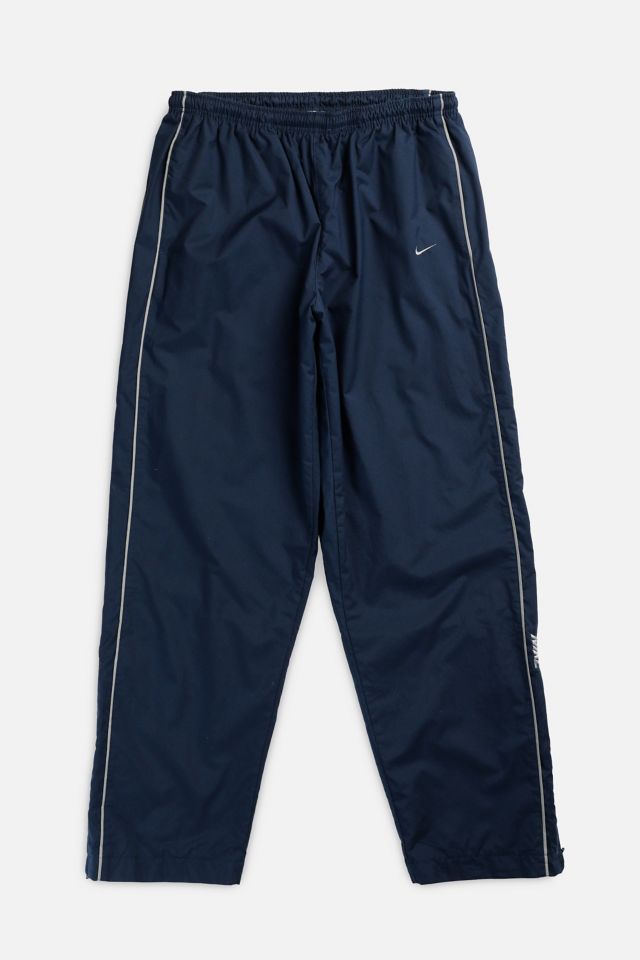 Blue nike windbreaker pants best sale