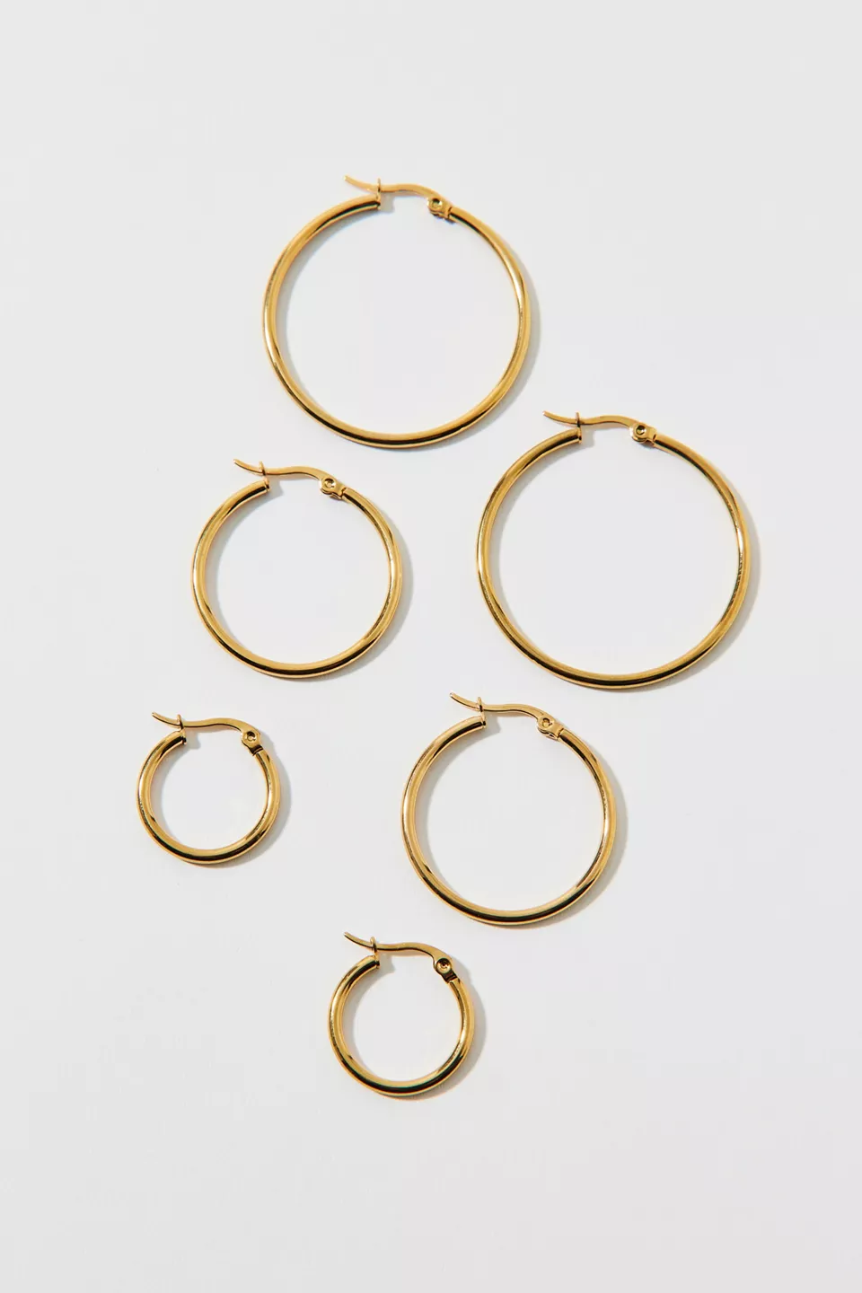 Three pairs of gold hoop earrings