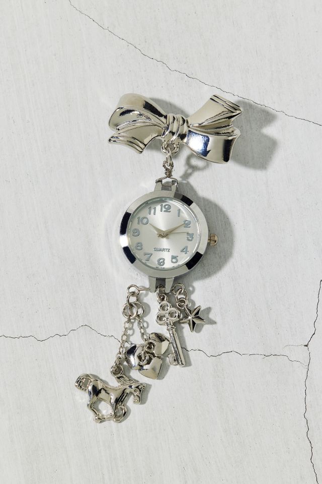 Broche montre à charmes en forme de noeud #1