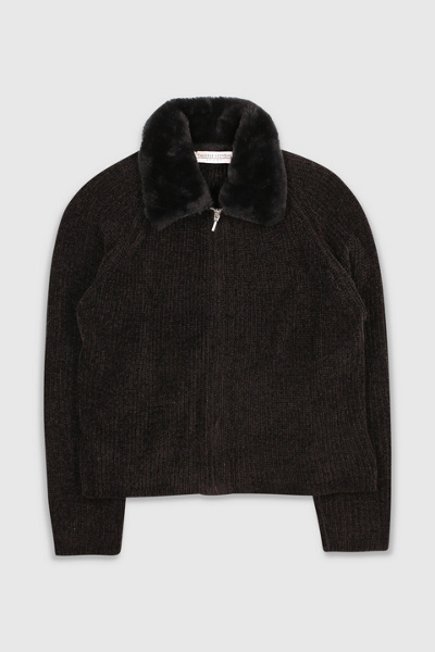 Premium AI Image | a woman wearing a sweater with a fur collar and a